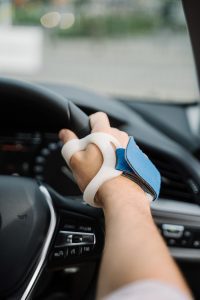 Driver driving with wrist brace