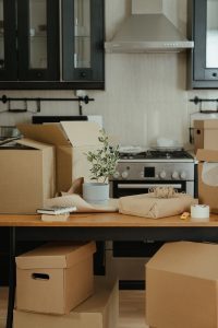 Numerous moving boxes in a kitchen