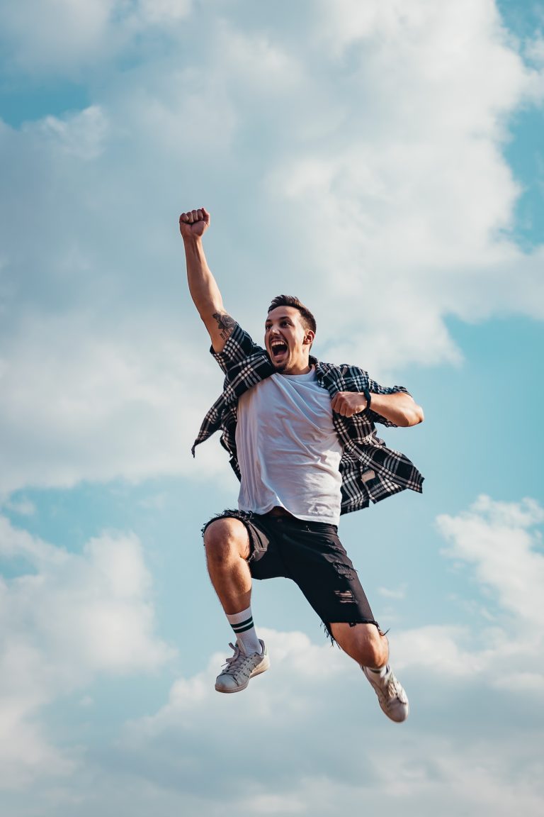 Scullion LAW client excited leaping in the air fist pumping