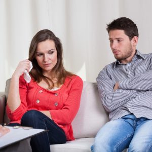 Couple sit discussing alternatives to divorce
