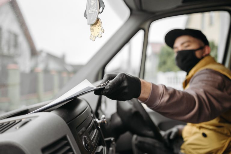 Driver in face mask drops his insurance