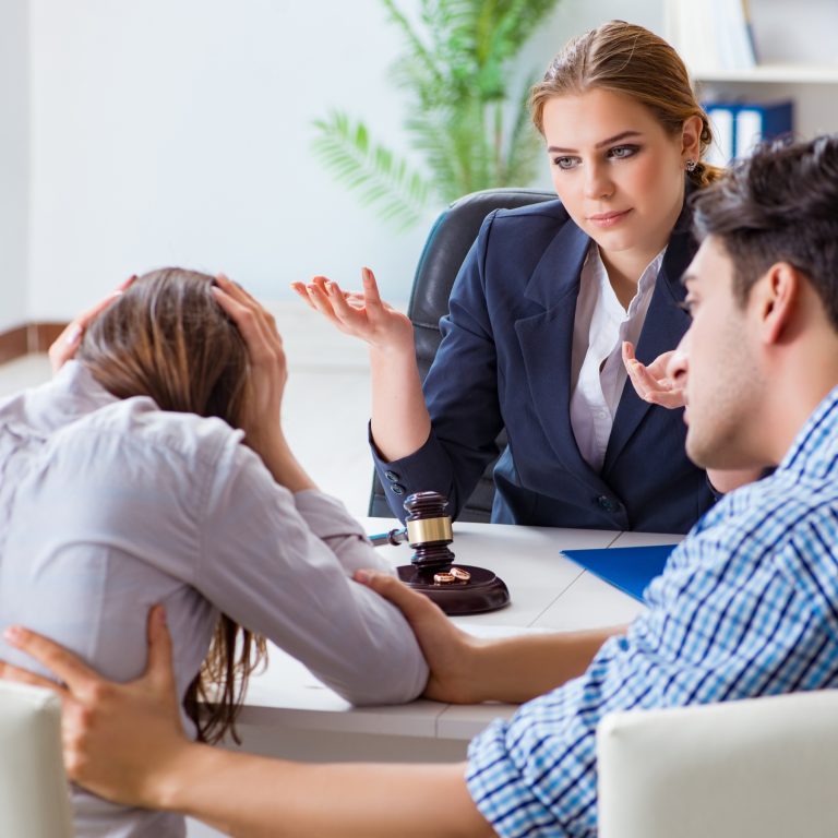 Couple sits with lawyer during as an alternative to divorce