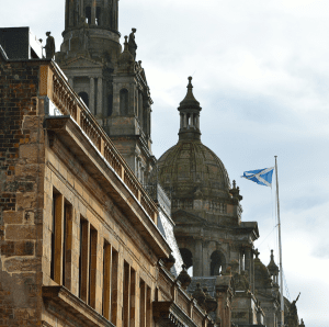 building with Scottish Flag on a mast pole