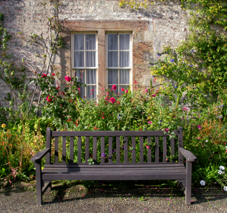 A bench sitting outside a house in Scotland