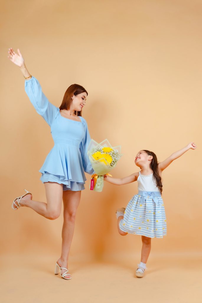 Mom and Daughter share special moment with flowers