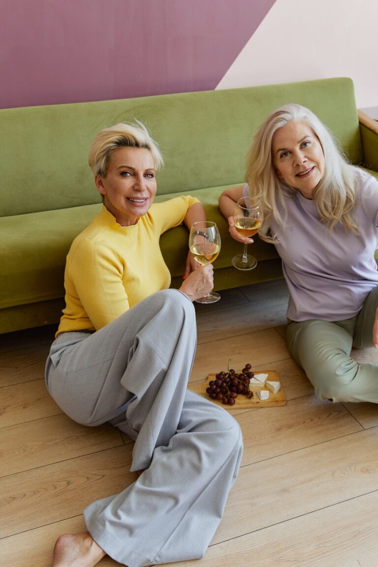 Cohabitating ladies with glasses of white wine