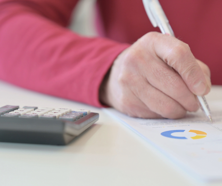 elderly man signing estate paperwork