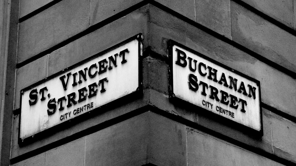 Street Signs on a building reads St Vincent Street and Buchanan Street. 