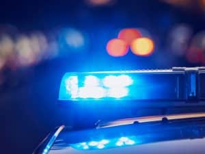 Close-up shot of Scottish Police car lights at night, highlighting Scullion LAW's expertise in drug driving cases.