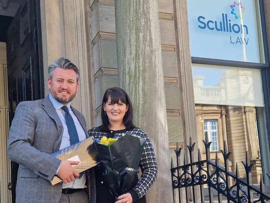 Scullion LAW’s Head of Road Traffic and Criminal Law, Kris Buchanan, and newly promoted Associate Director Stephanie Grieve, standing outside the Hamilton office, celebrating leadership in Scottish criminal defence and road traffic law.