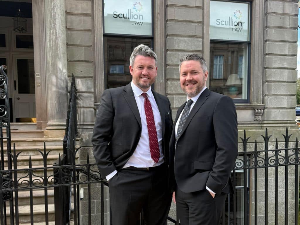 Kris Buchanan, Head of Road Traffic and Criminal Law at Scullion LAW, welcomes newly appointed Solicitor Advocate Darren Fleming to the firm. The photo shows them standing outside Scullion LAW’s Hamilton office.
