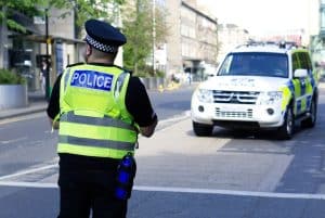 Police Scotland executing a warrant on a suspect charged with firearms offences and organised crime. Scullion LAW top rated in Scotland for criminal defence of serious and organised crime.