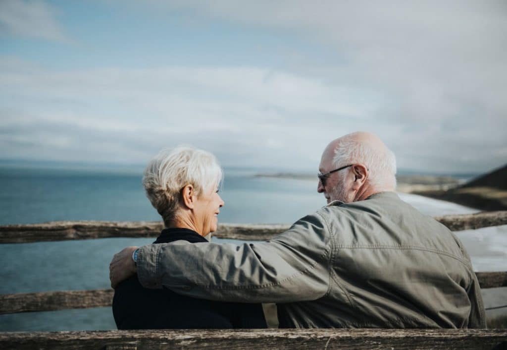 Older couple smiling planning their estate together with Scullion LAW Scotland's Top Rated Estates and Probate Solicitors
